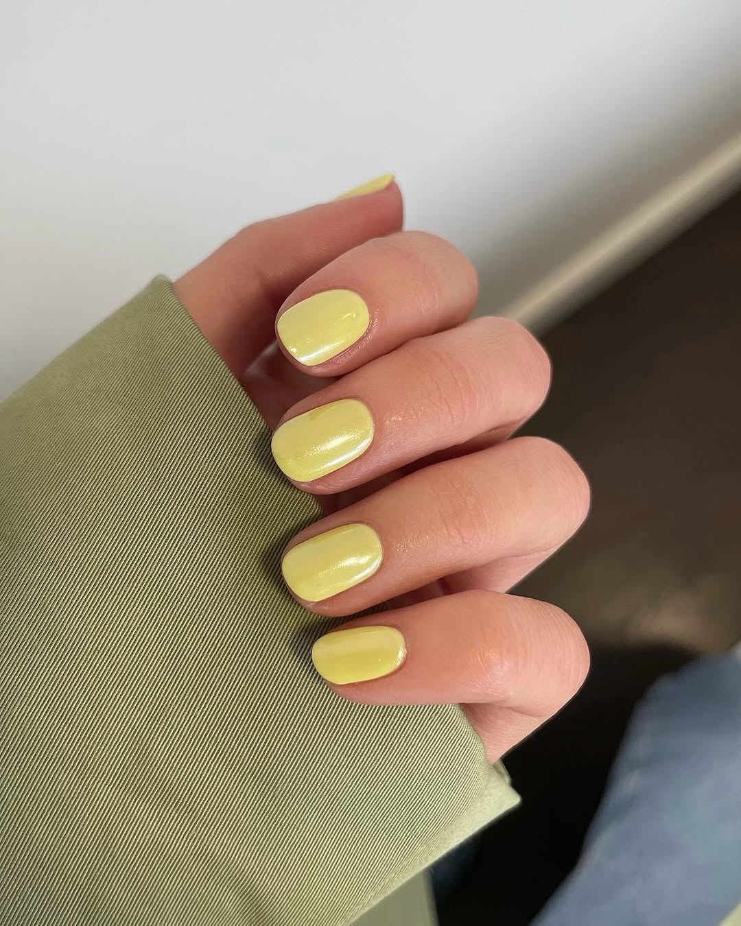 Bright yellow nails with a cozy vibe