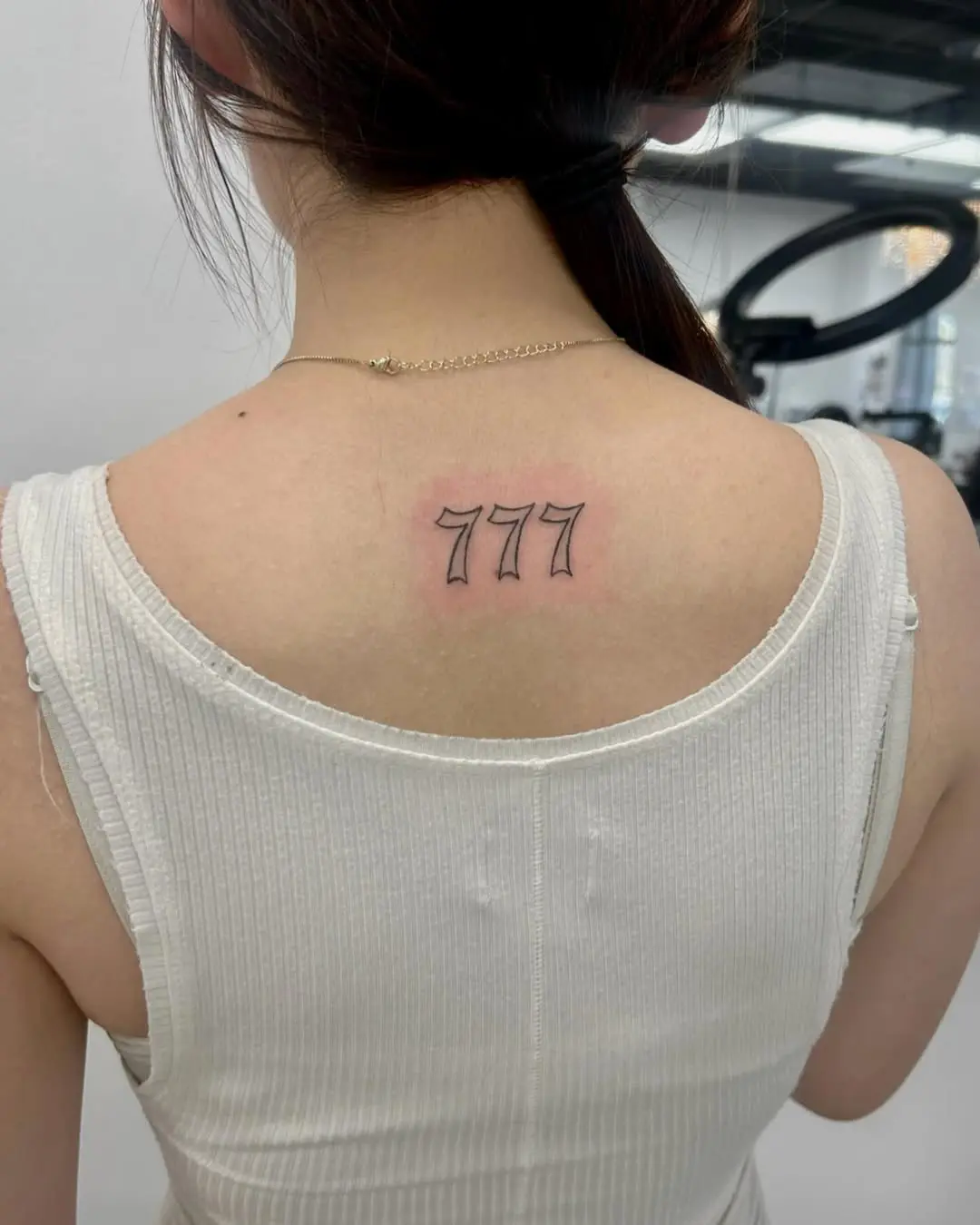 Minimalist 777 Tattoo on the Back