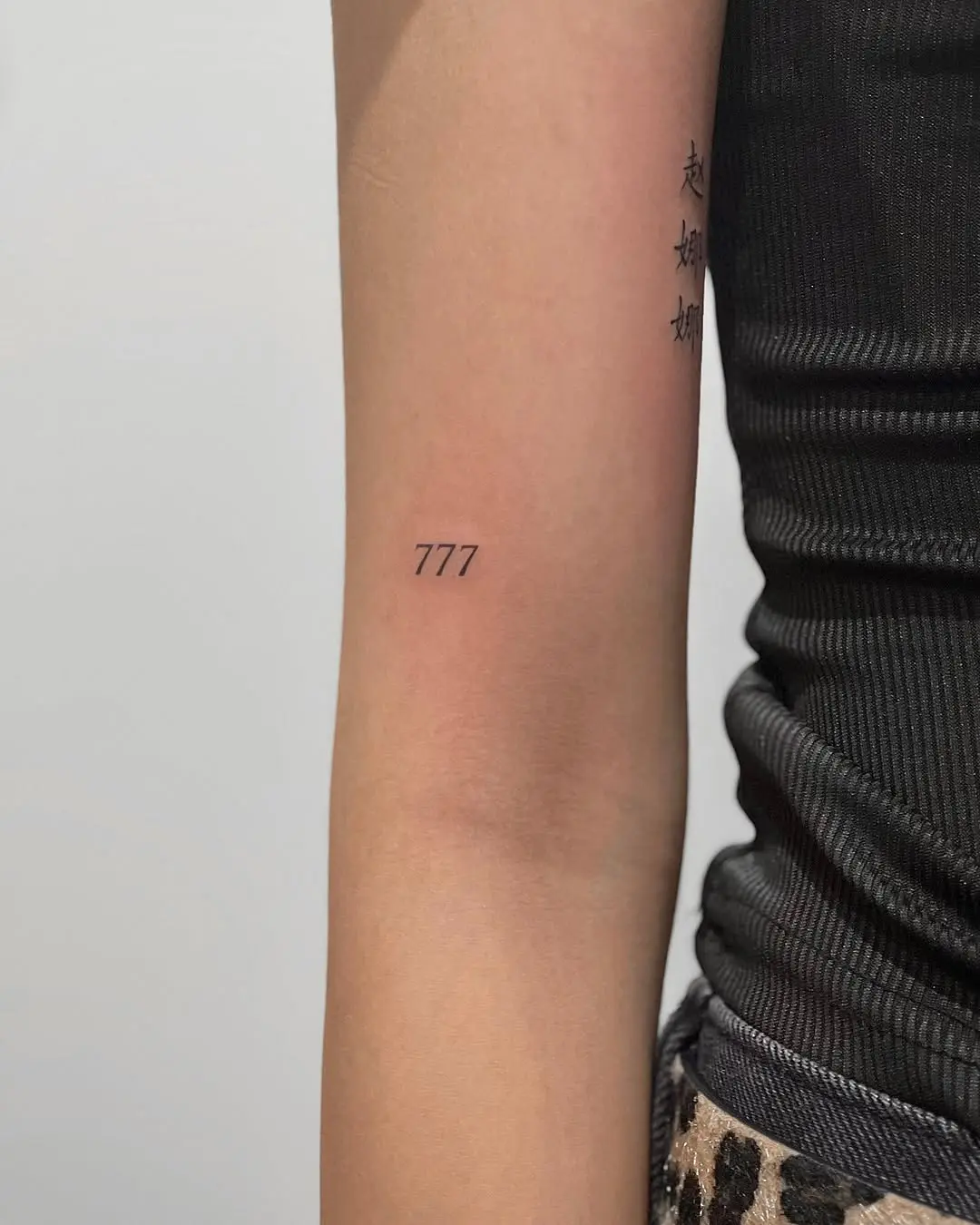 Minimalist 777 Tattoo on the Arm