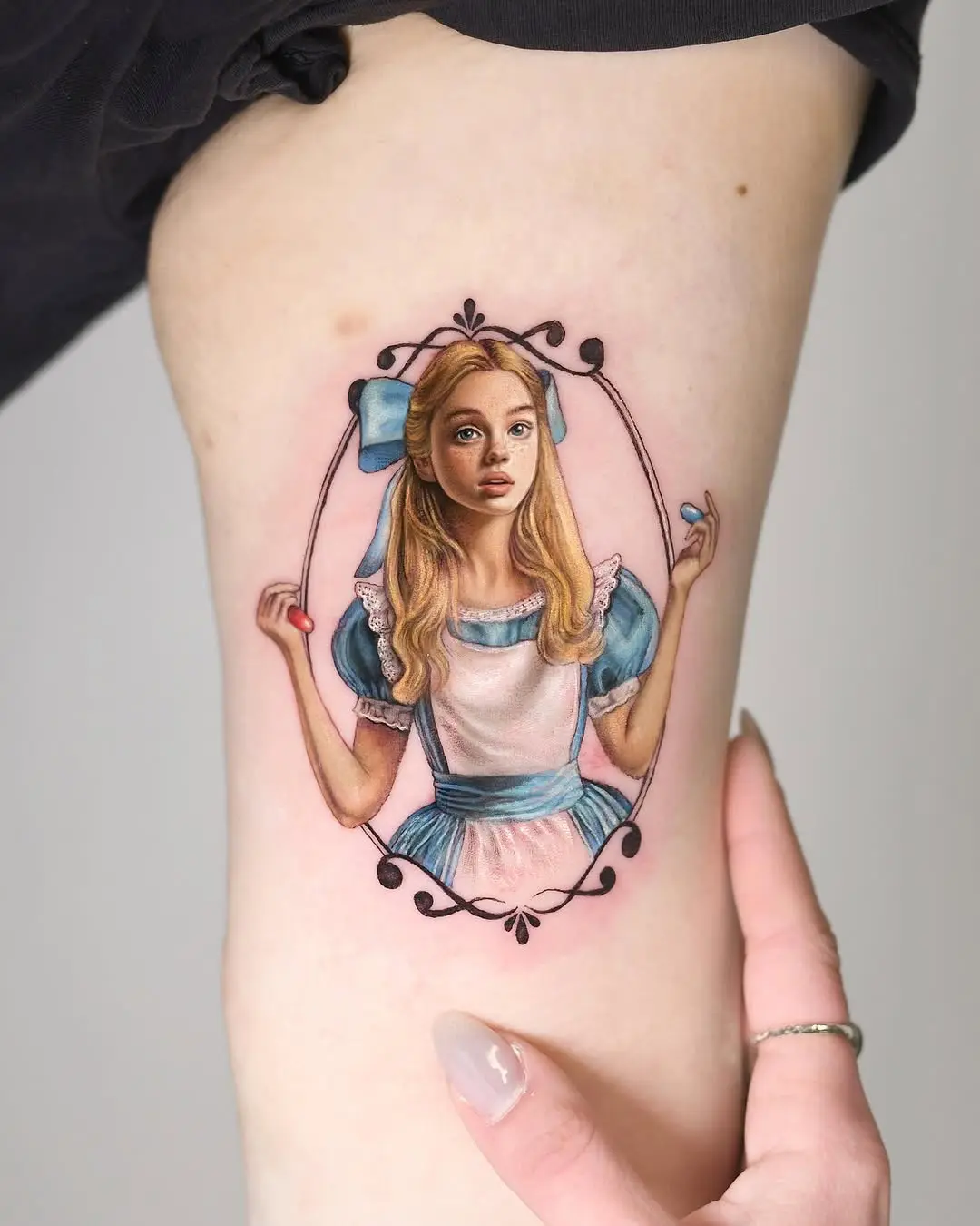 Stunning realistic Alice in Wonderland tattoo