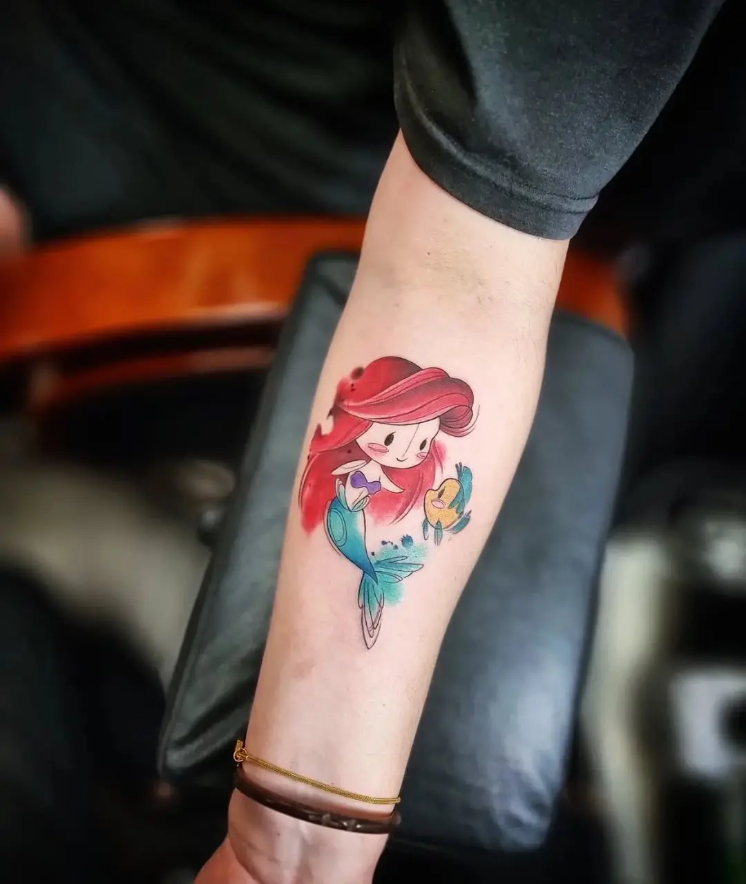 Vibrant Ariel Tattoo Radiates Underwater Charm
