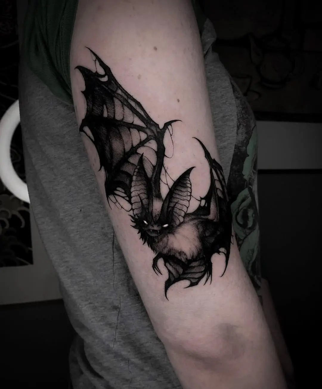 Dramatic bat tattoo showcasing intricate details