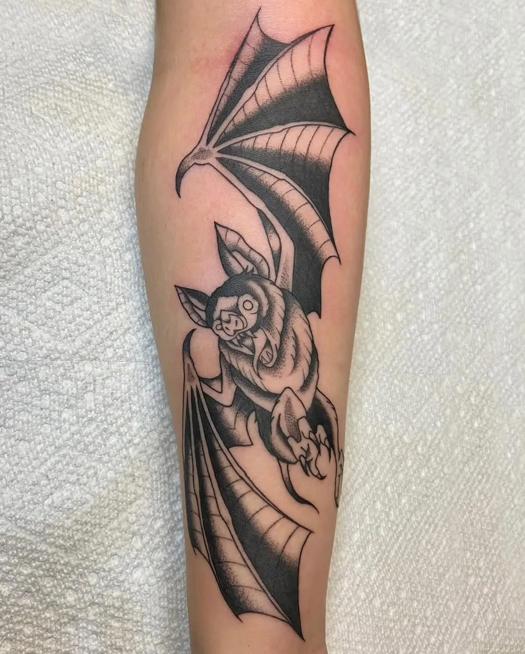 Intricate bat tattoo design in bold black ink
