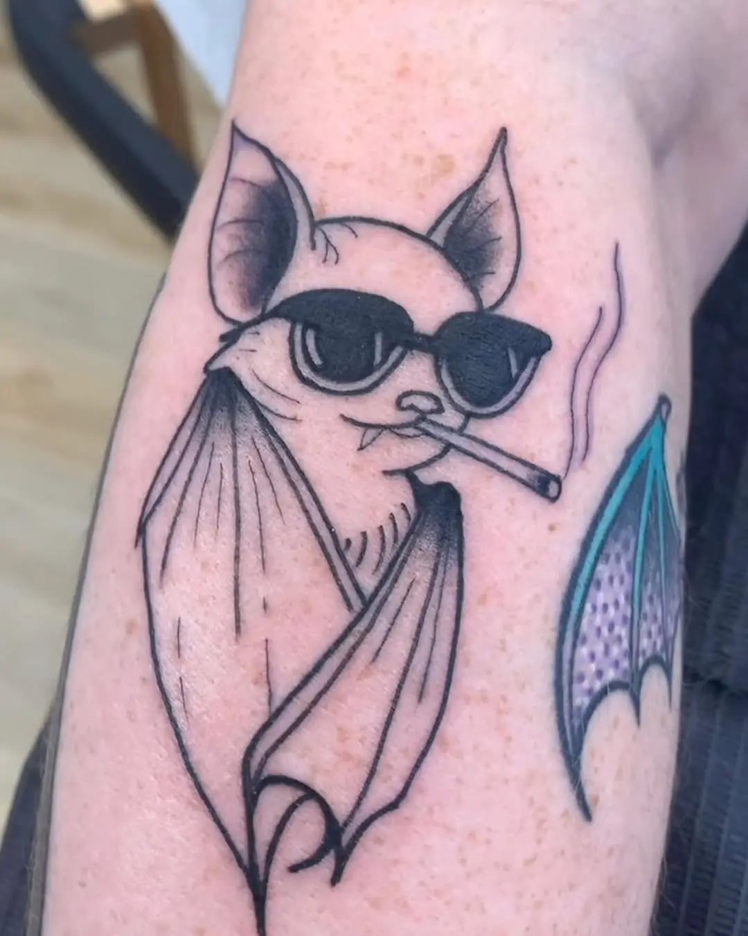 Stylishly cool bat tattoo with attitude