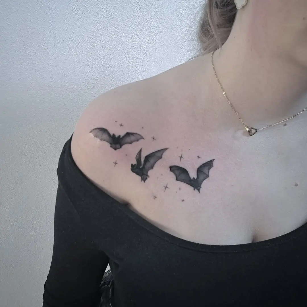 Elegant bat tattoos with celestial accents