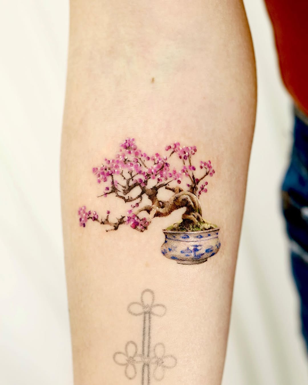 Bonsai tree tattoo with delicate flowers