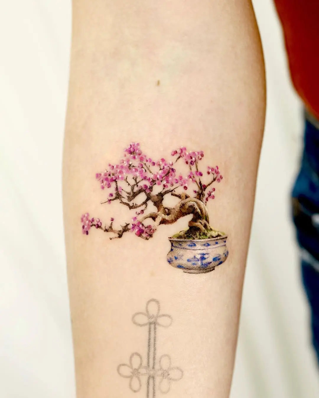 Bonsai tree tattoo with delicate flowers