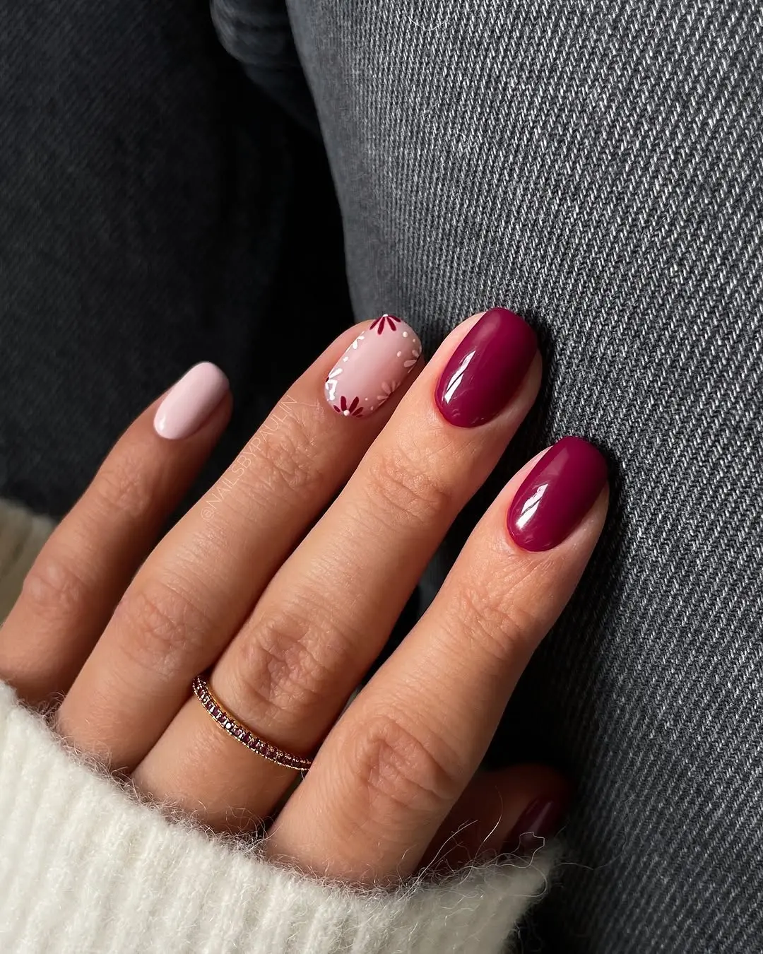 Chic burgundy nails with intricate design accents