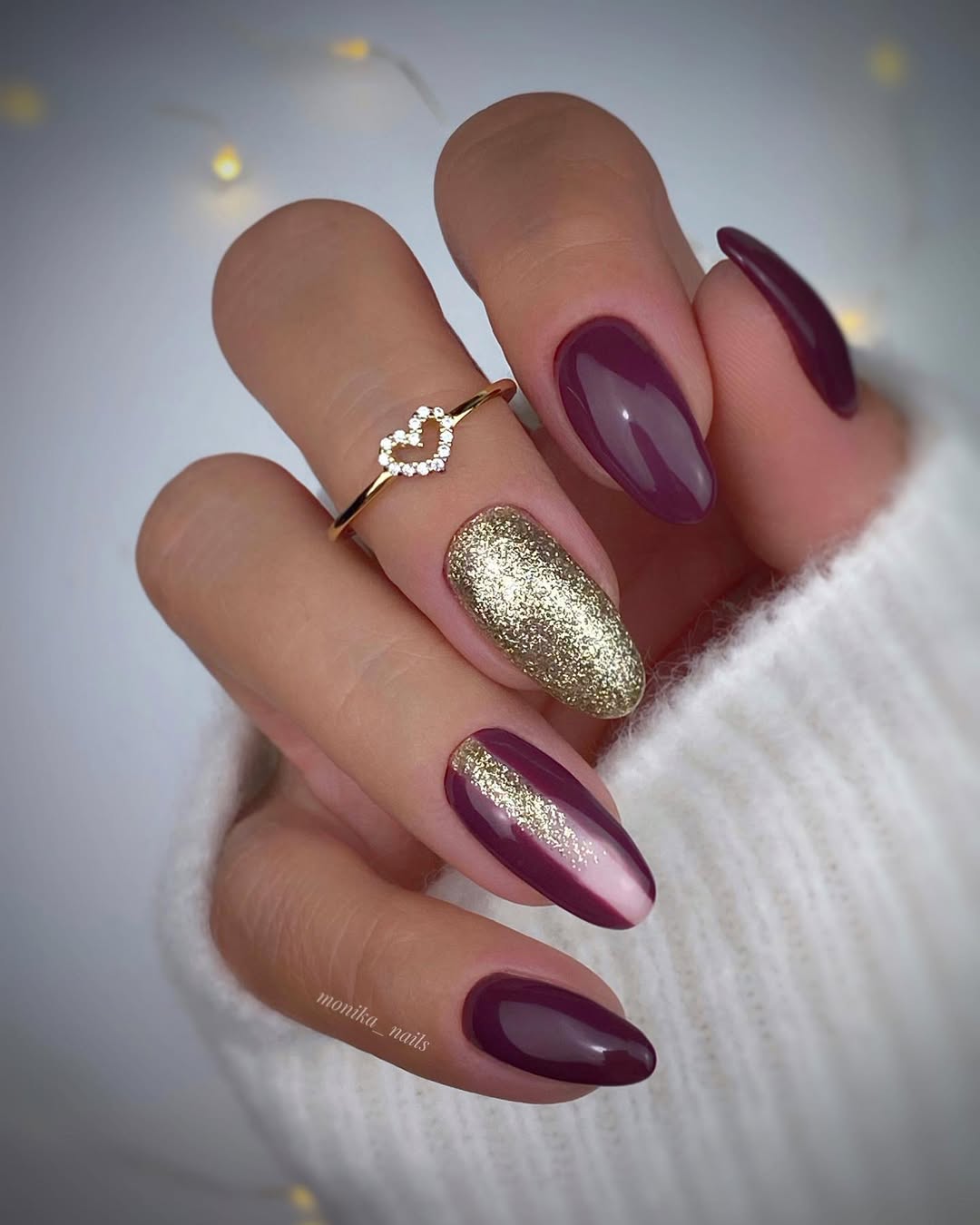 Elegant burgundy nails with a touch of gold