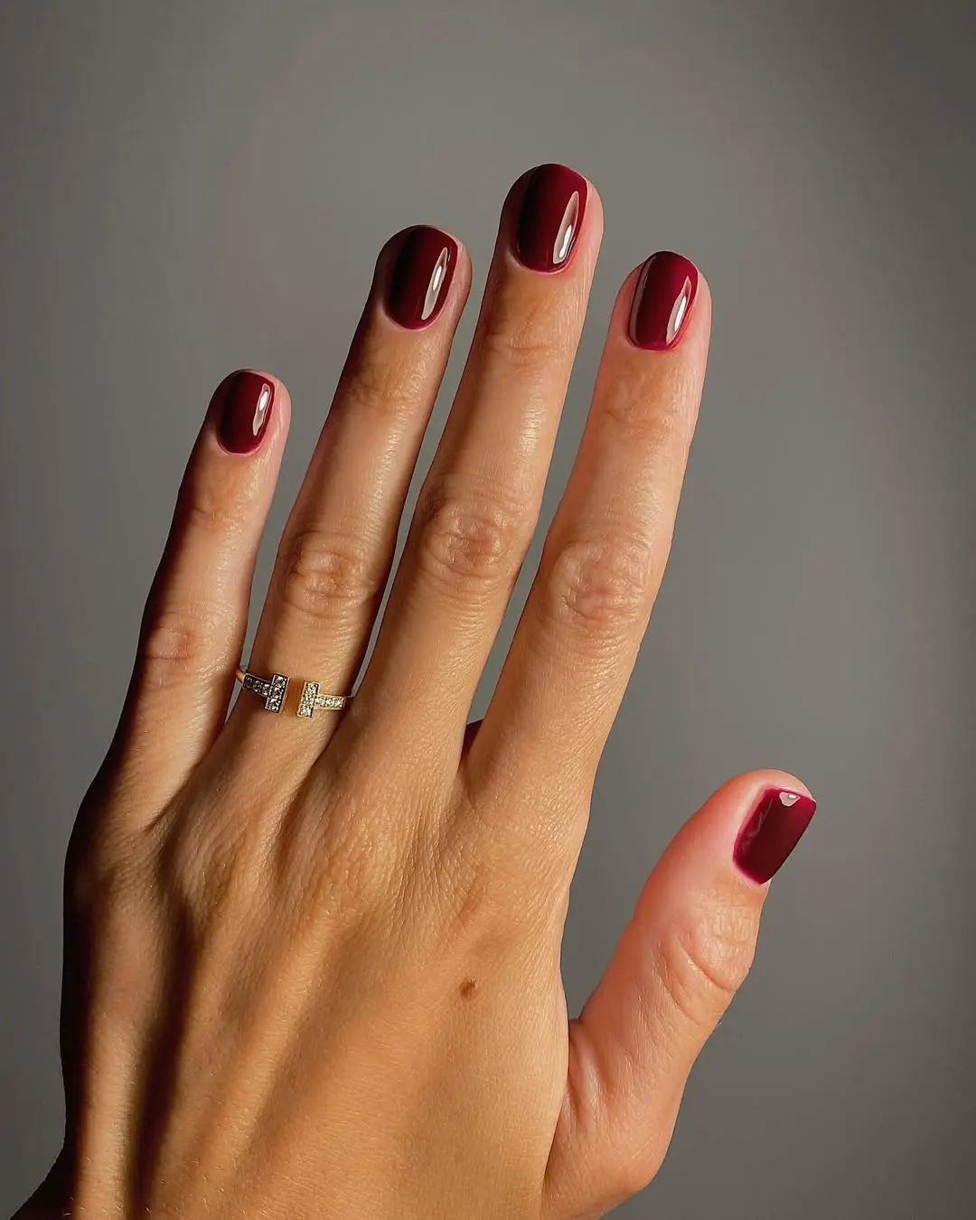 Stylish gloss on chic burgundy nails