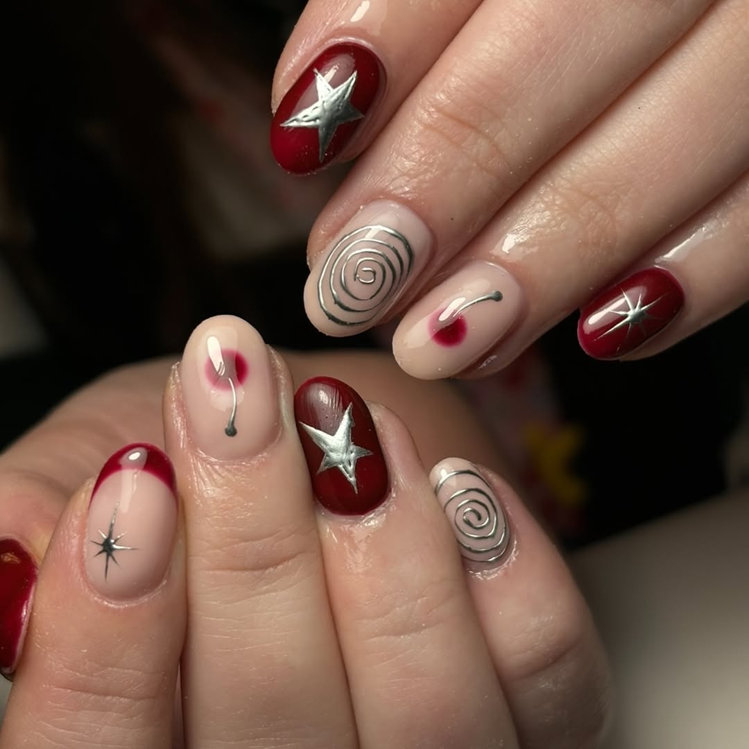 Chic burgundy nails with dazzling silver accents