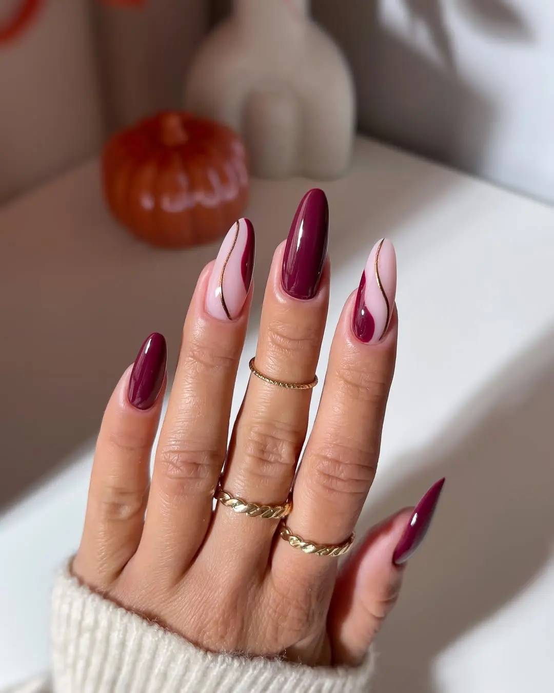 Chic burgundy nails with playful accents