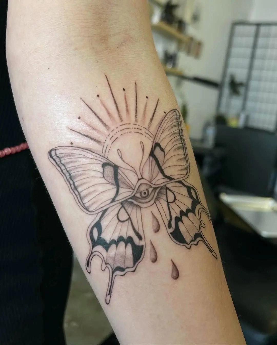 Symbolic butterfly tattoo illustrating transformation themes