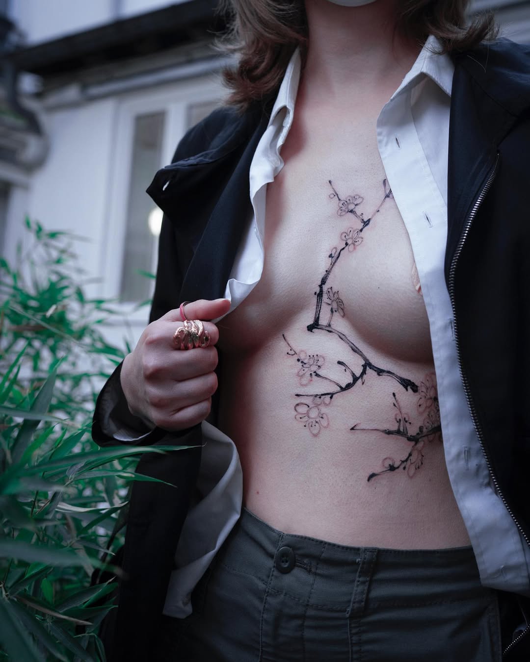 Elegant cherry blossom tattoo on the torso