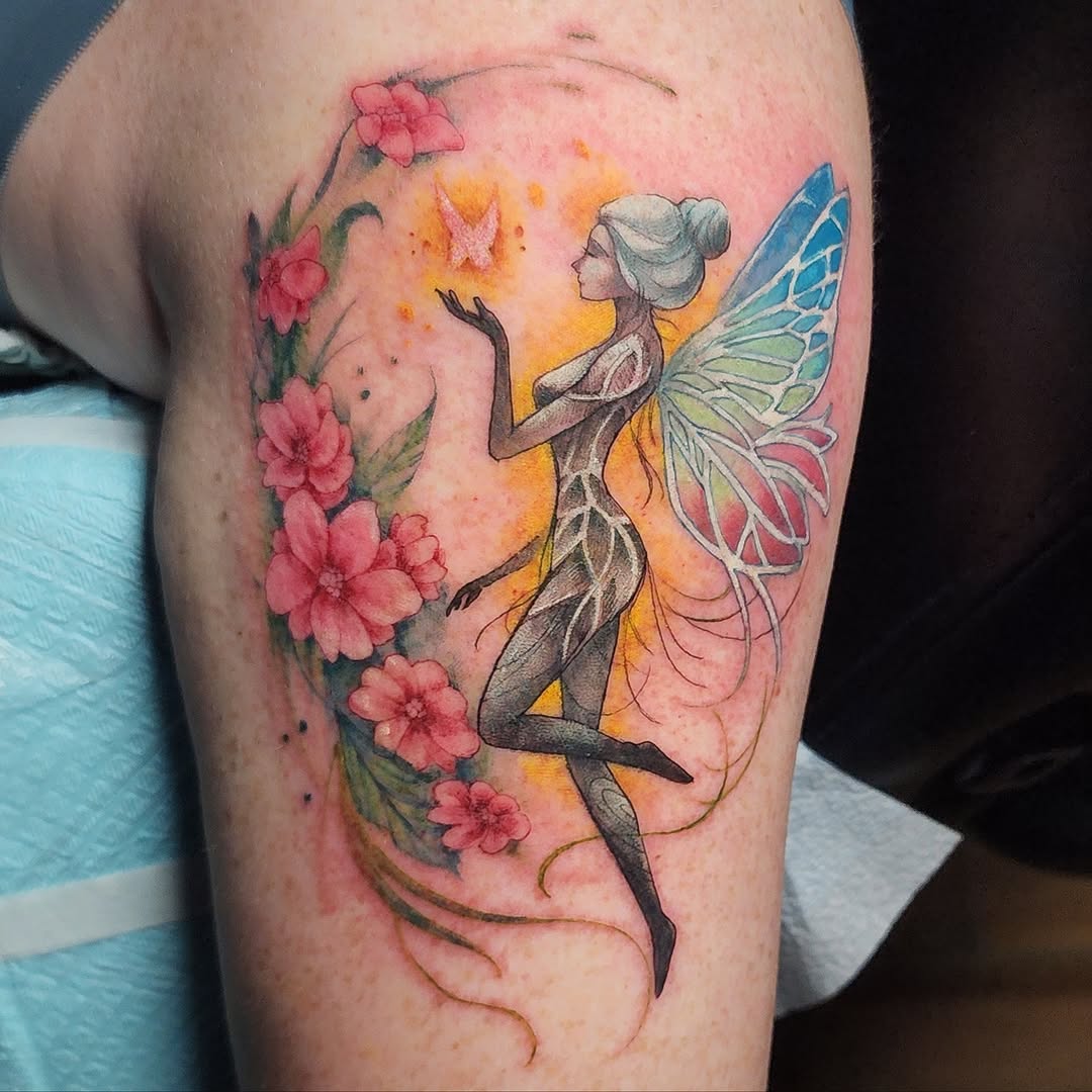 Enchanting fairy tattoo amidst blooming flowers