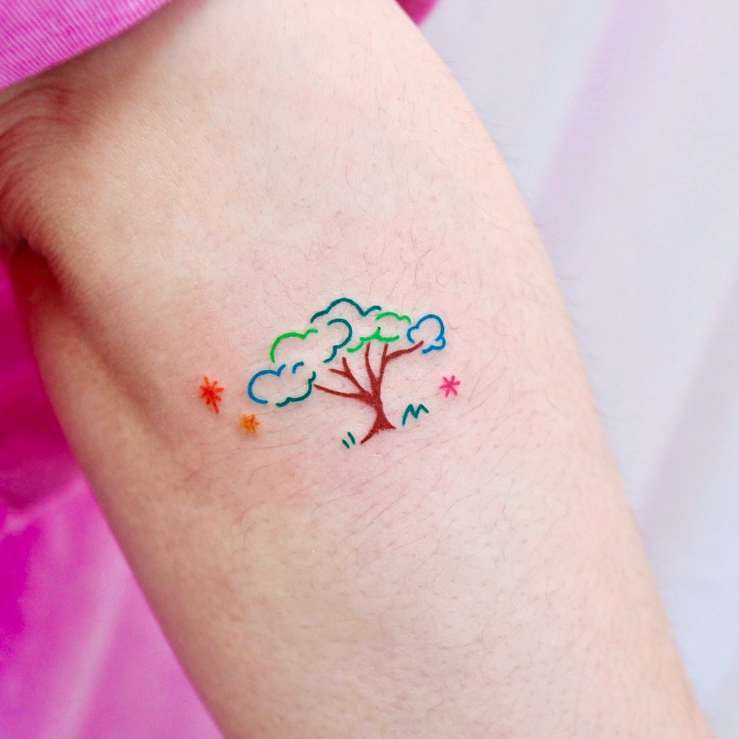 A playful minimalist tree tattoo design