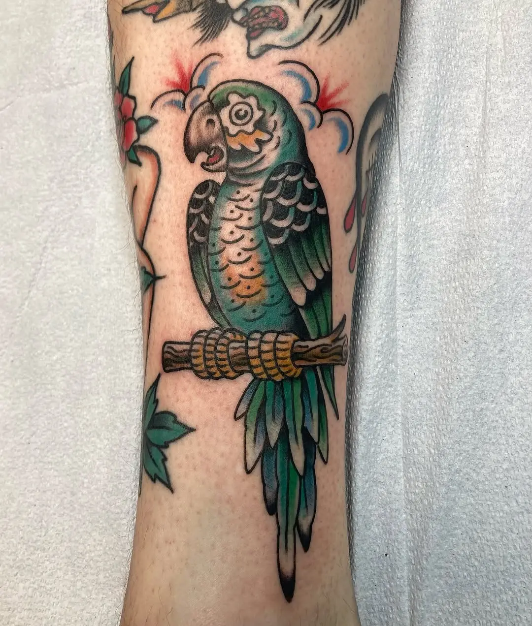 Vibrant parrot tattoo showcasing detailed artistry