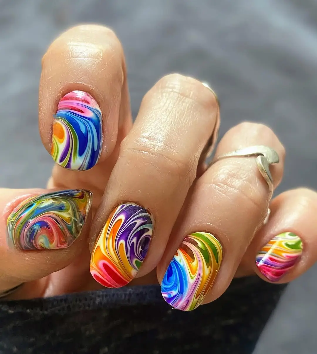 Vibrant swirls of color on stylish nails