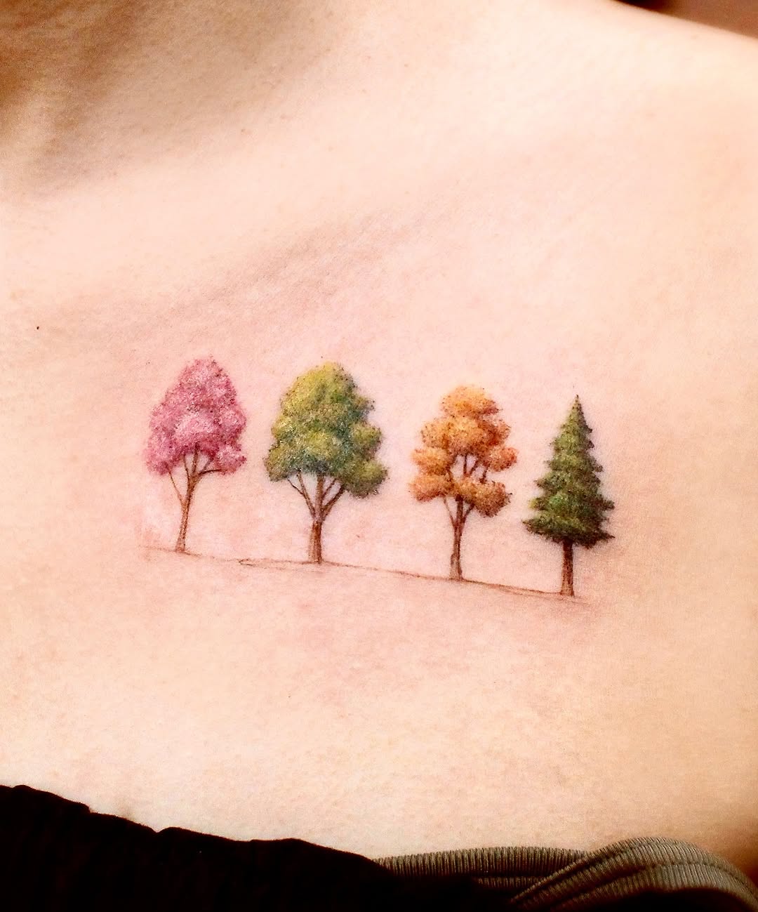Vibrant tree tattoo showcasing seasonal colors