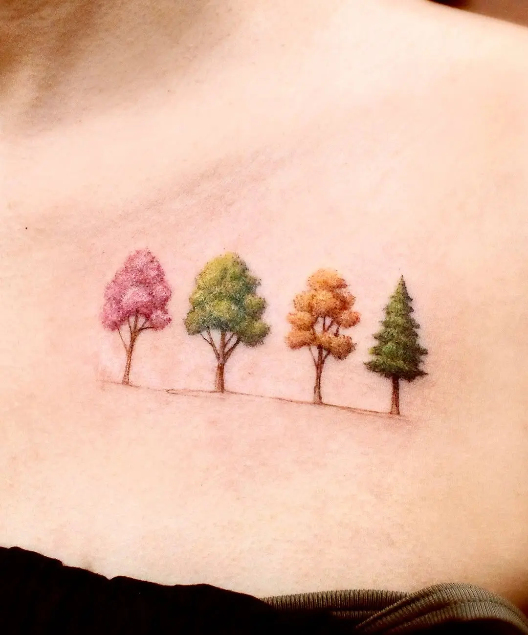 Vibrant tree tattoo showcasing seasonal colors