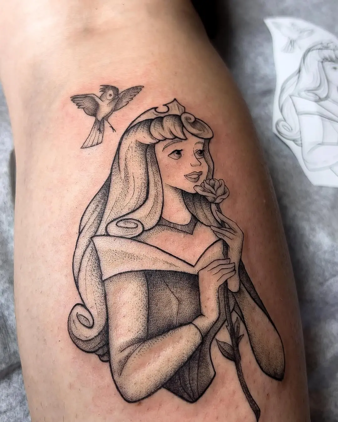 Vintage-style Aurora tattoo with nature elements