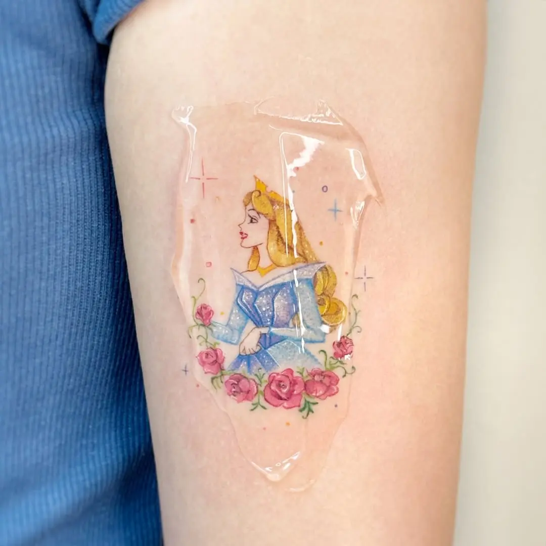 Enchanting Aurora tattoo with floral elements