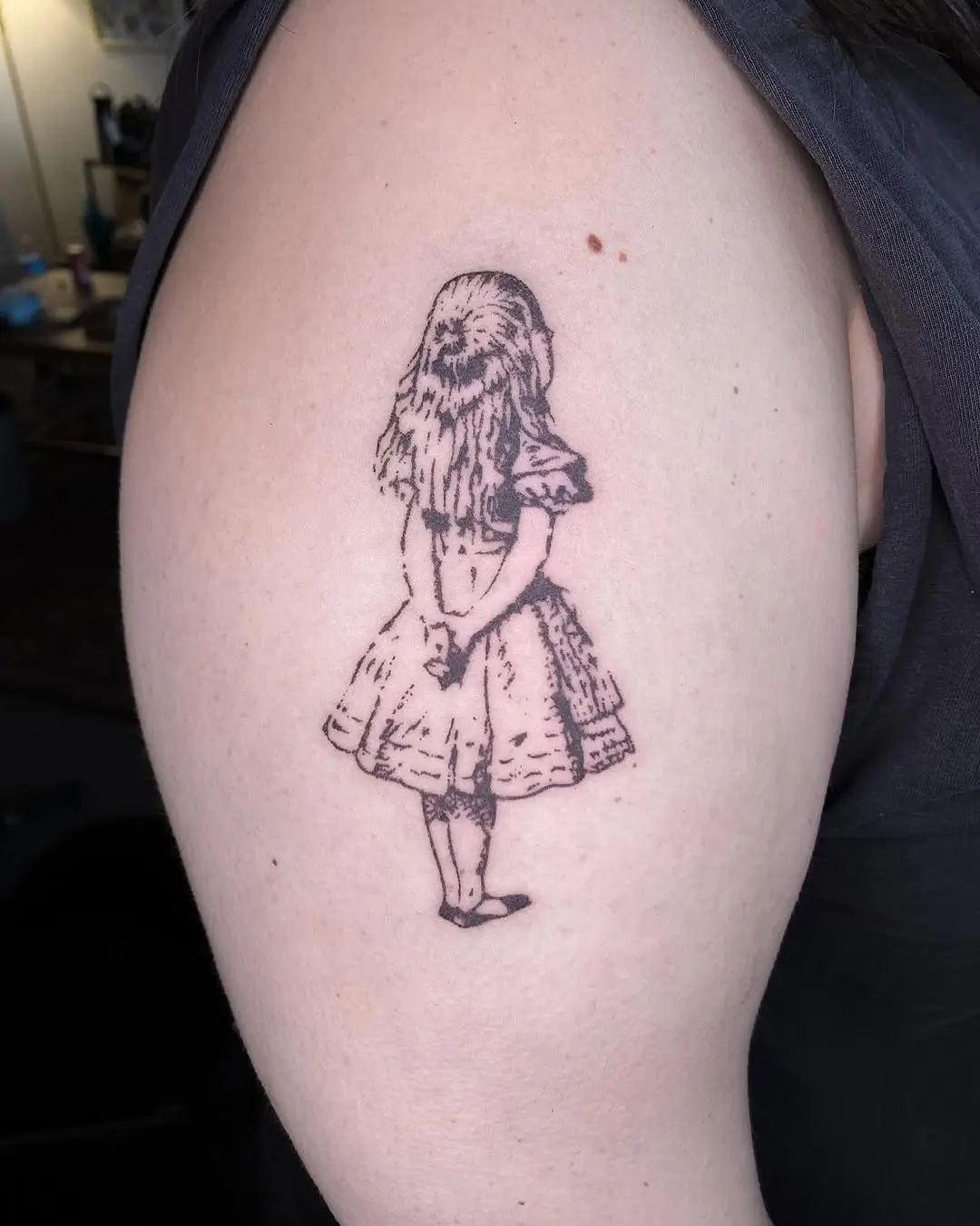 Enchanting Alice in Wonderland tattoo design.