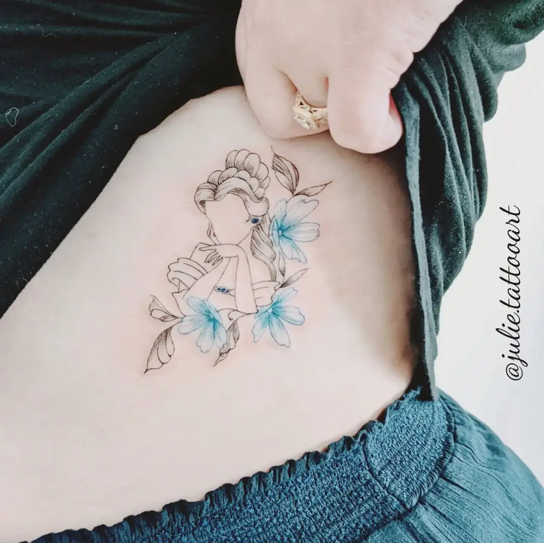 Elegant Belle tattoo with floral accents