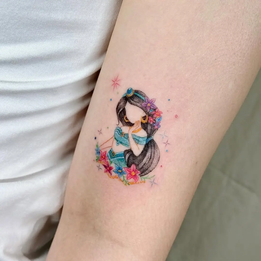 Whimsical tattoo of a Disney princess with blooms