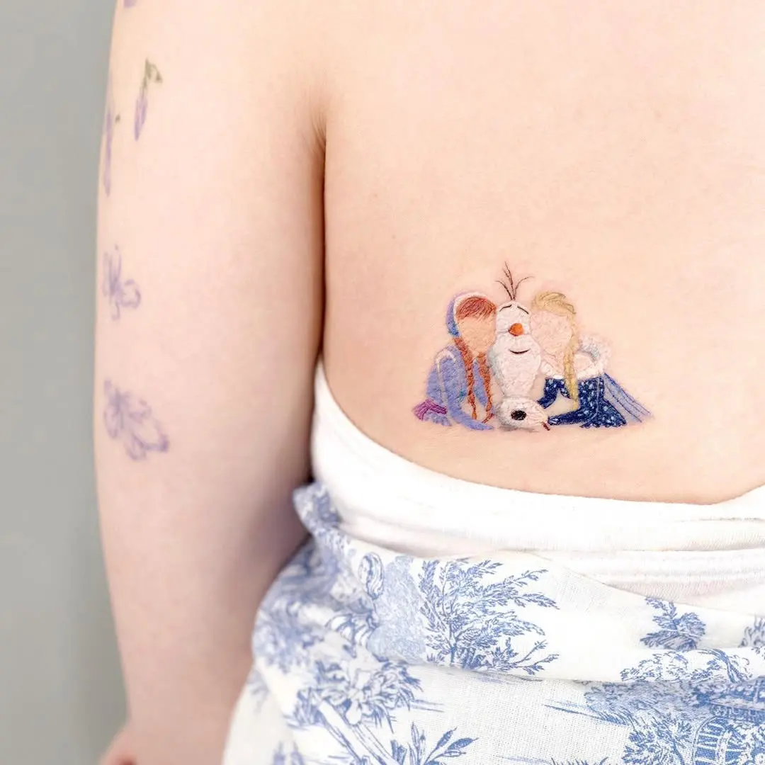 Charming Disney Princess tattoo with Olaf and friends