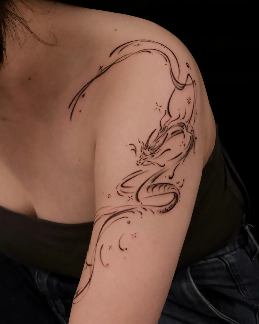 Elegant dragon tattoo design for women’s arm