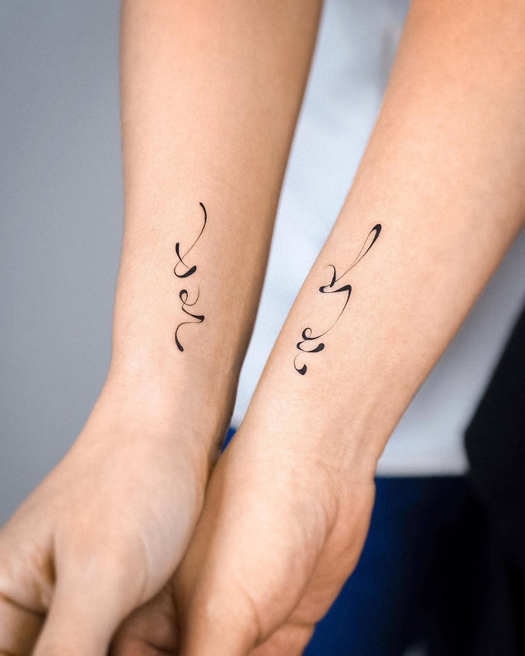 Symbolic twin tattoos showcasing unique designs