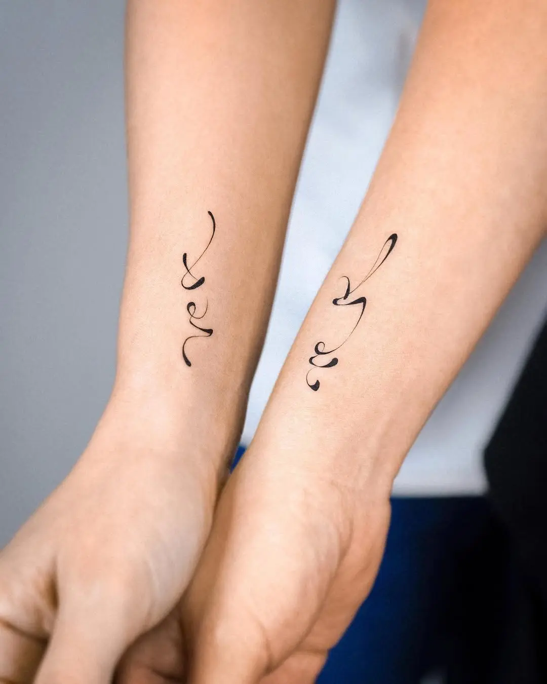 Symbolic twin tattoos showcasing unique designs