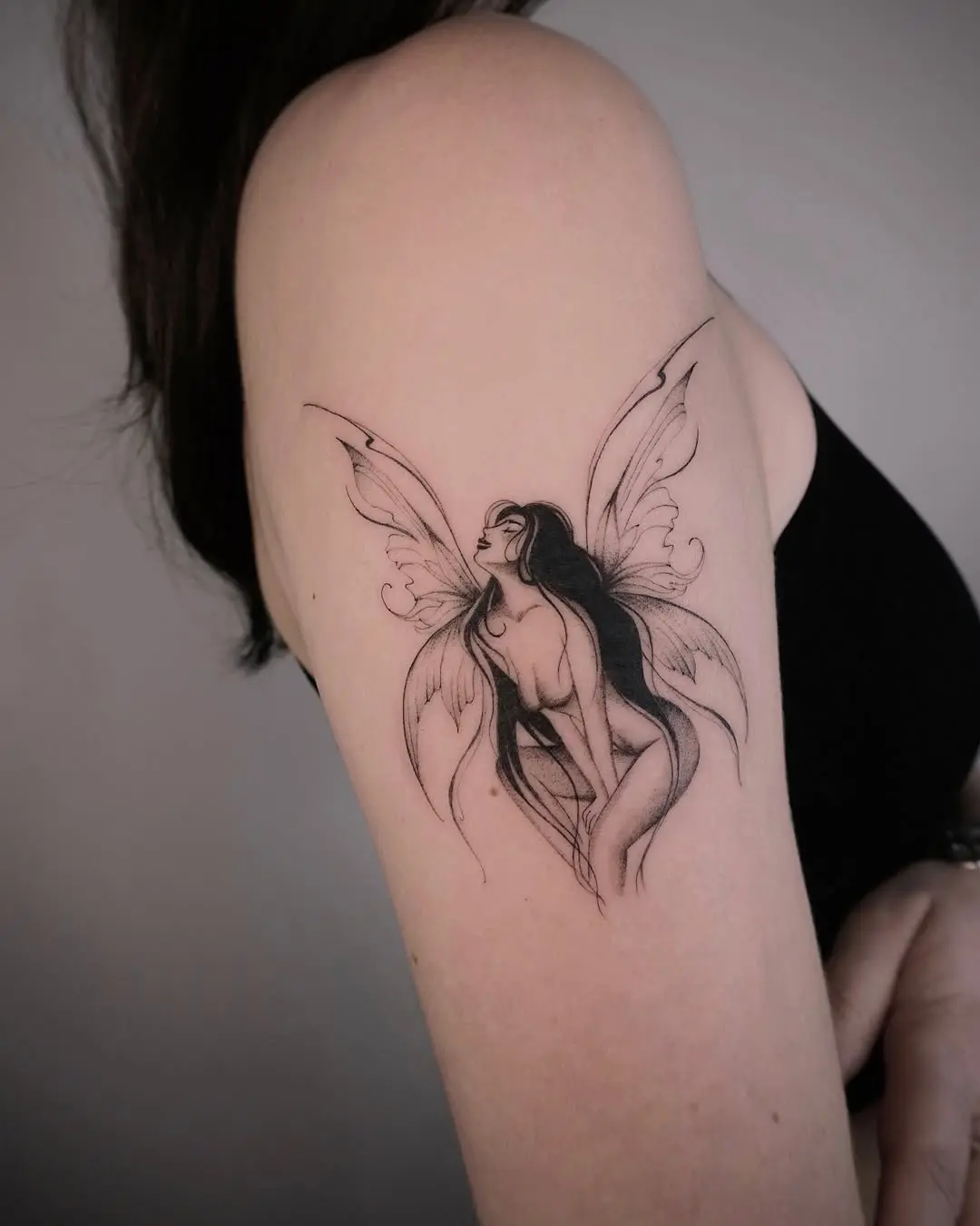 Elegant fairy tattoo with intricate butterfly wings