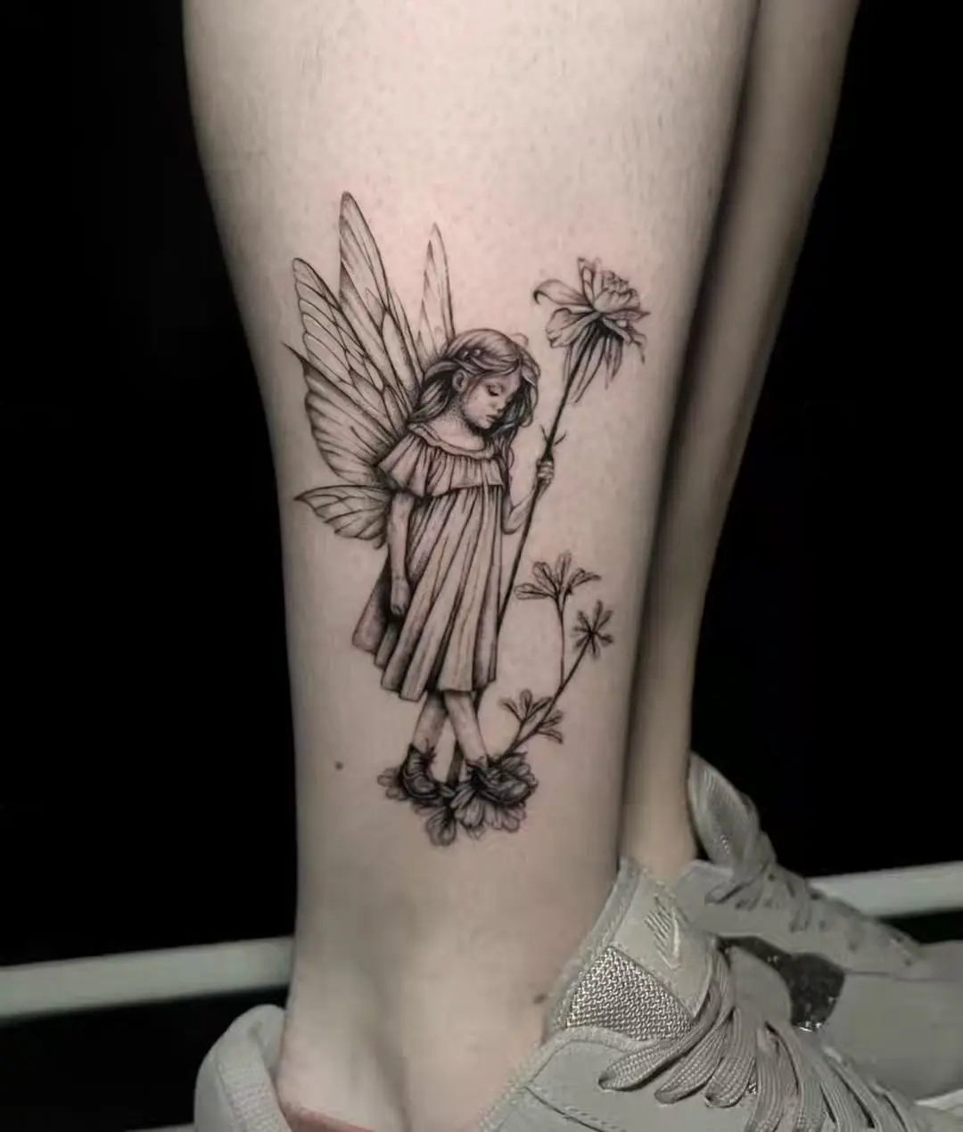 Enchanting fairy tattoo design on the leg