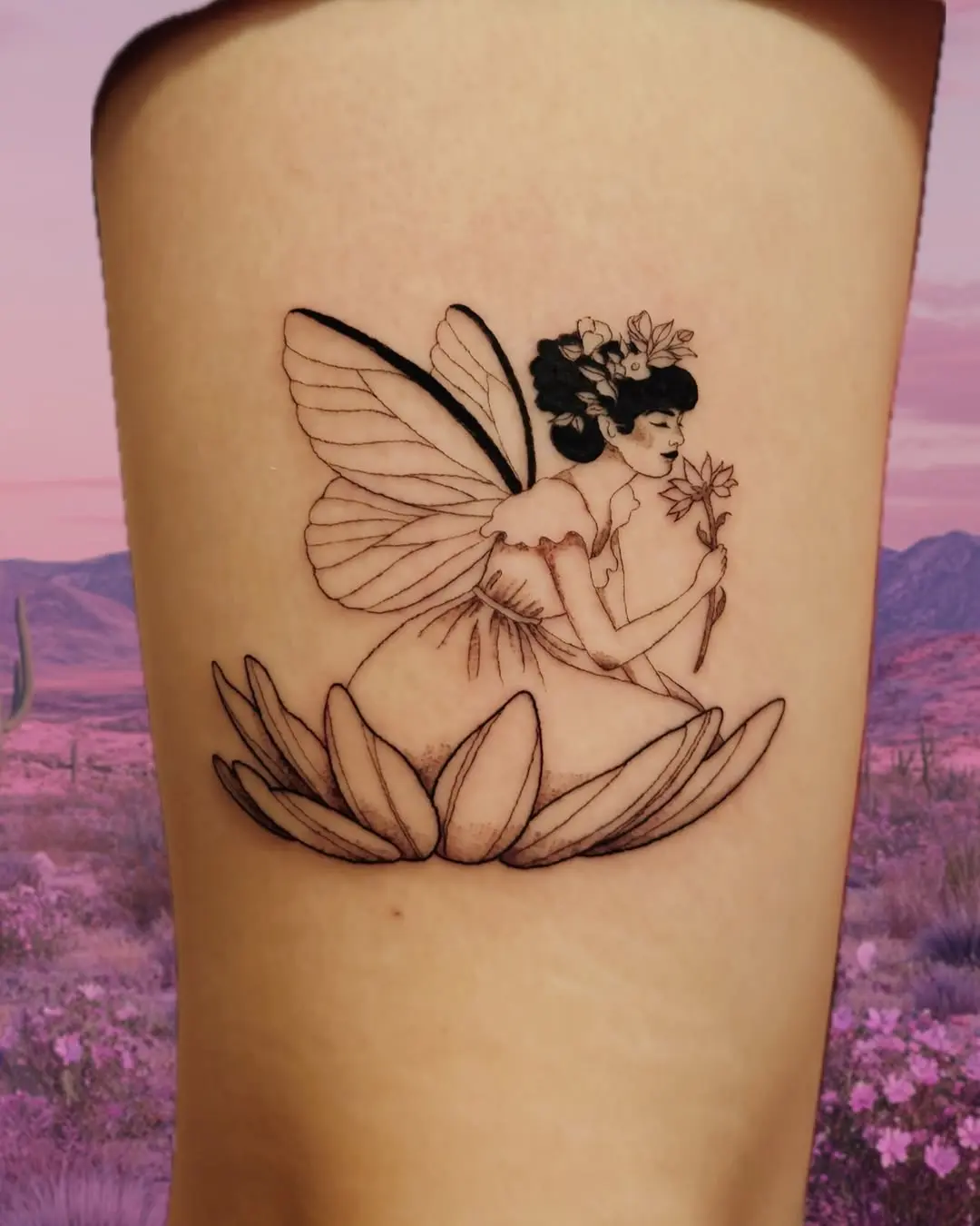 Delicate fairy surrounded by lotus flowers