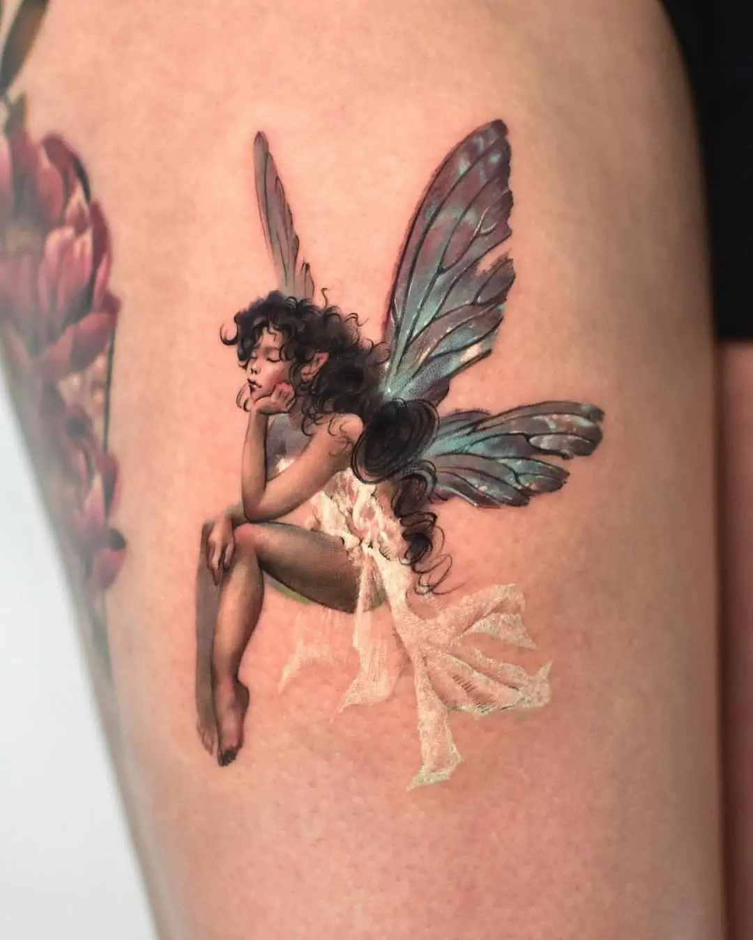 Whimsical fairy tattoo showcasing ethereal beauty