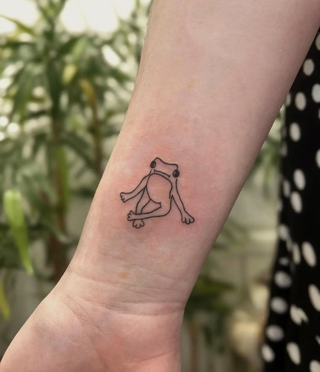 Minimalist Frog Tattoo on Forearm