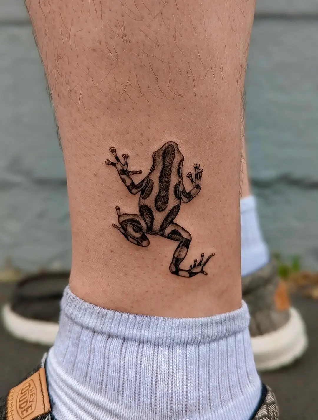 Elegant frog tattoo showcasing nature's artistry