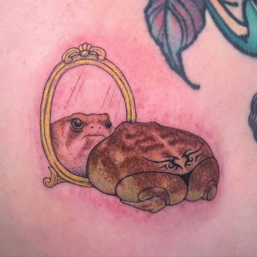 A whimsical frog tattoo reflecting self-love