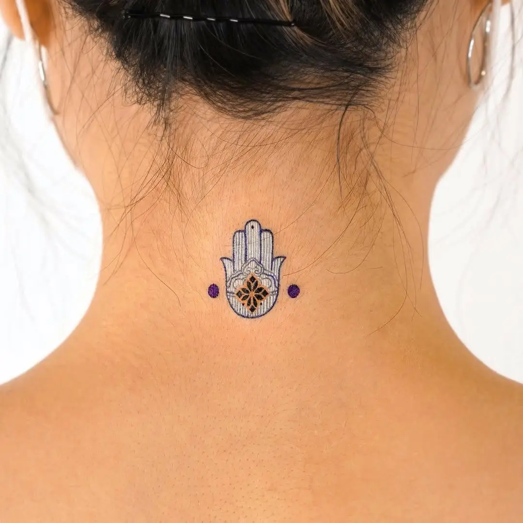 Symbolic strength through a hamsa tattoo