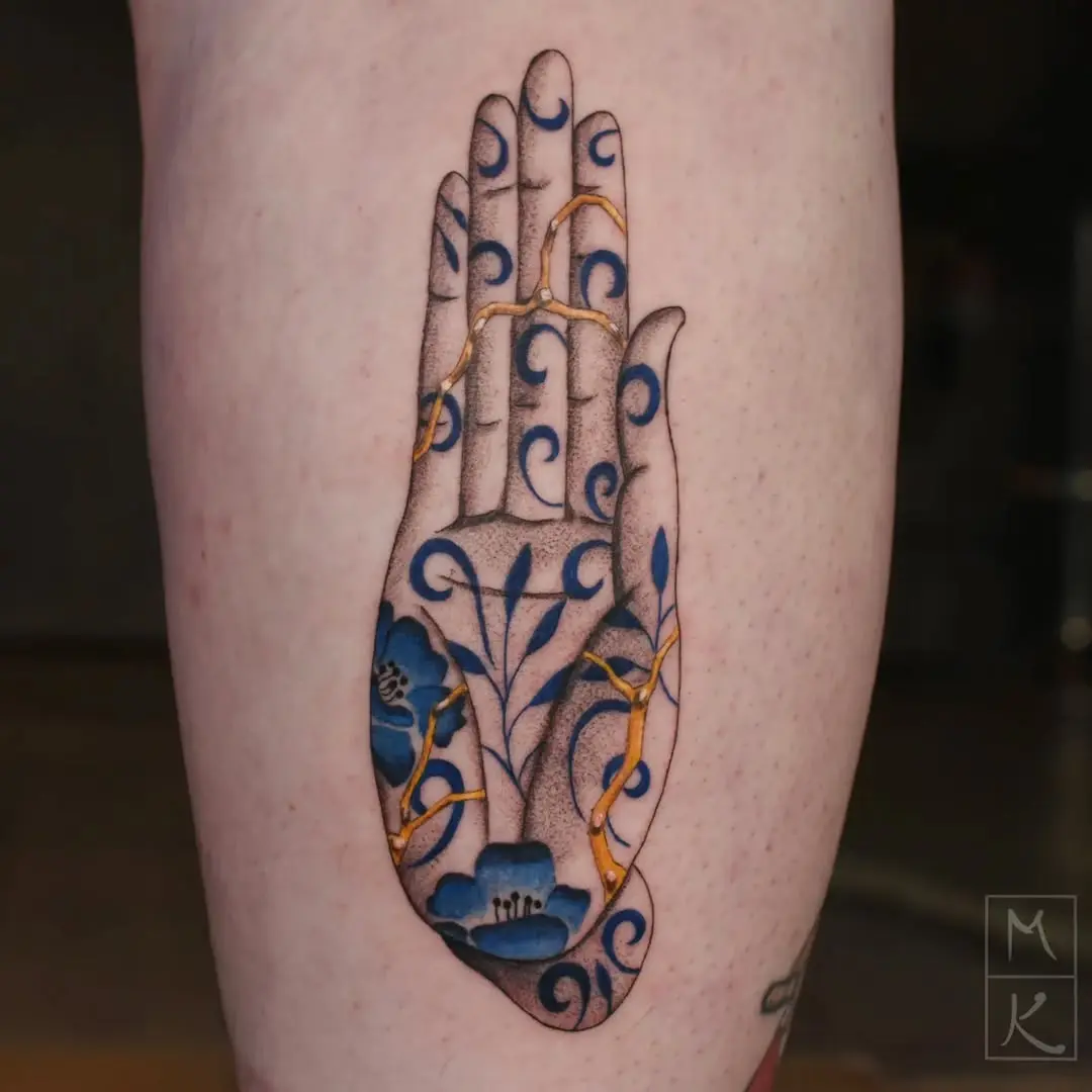 Artistic Kintsugi Hand Tattoo with Floral Elements