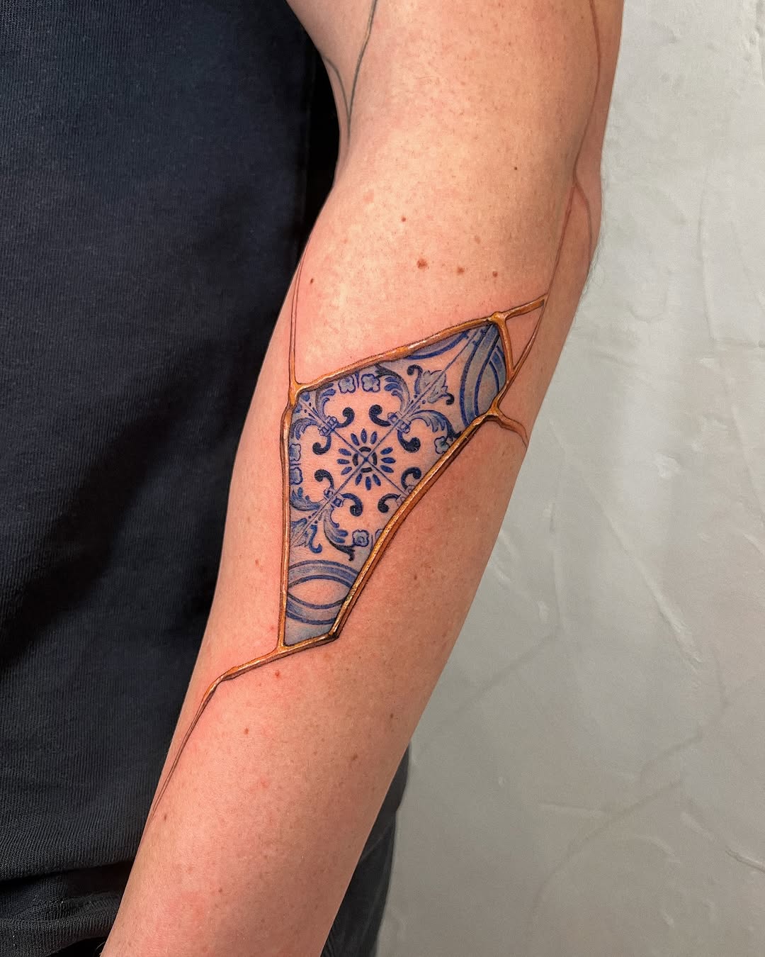 Elegant kintsugi tattoo with intricate designs