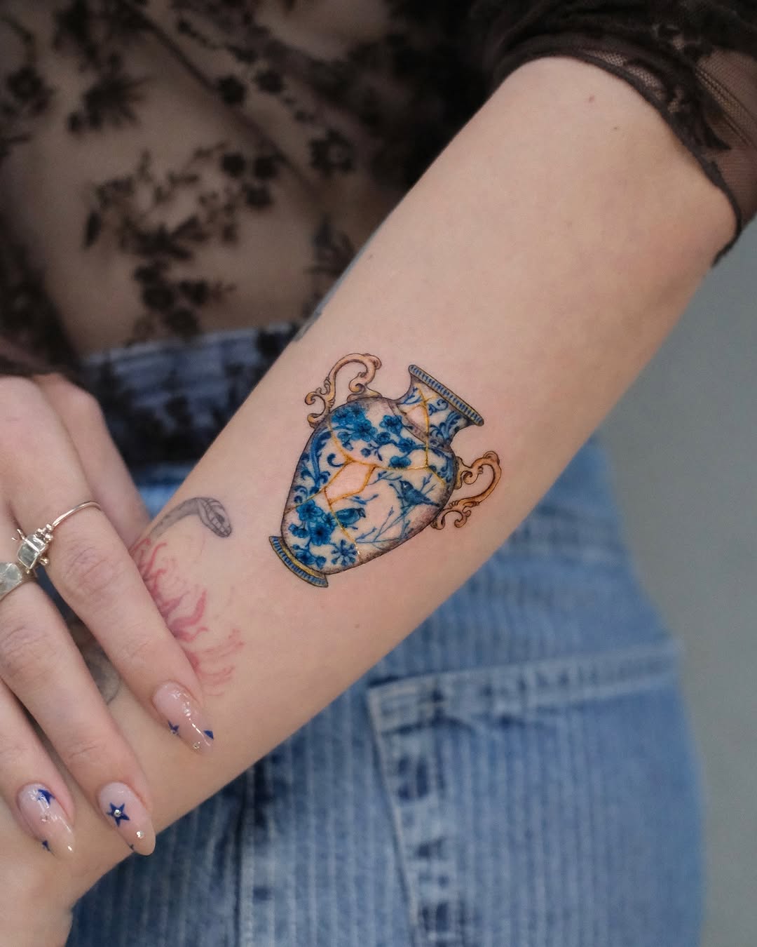 Delicate vase tattoo with intricate details
