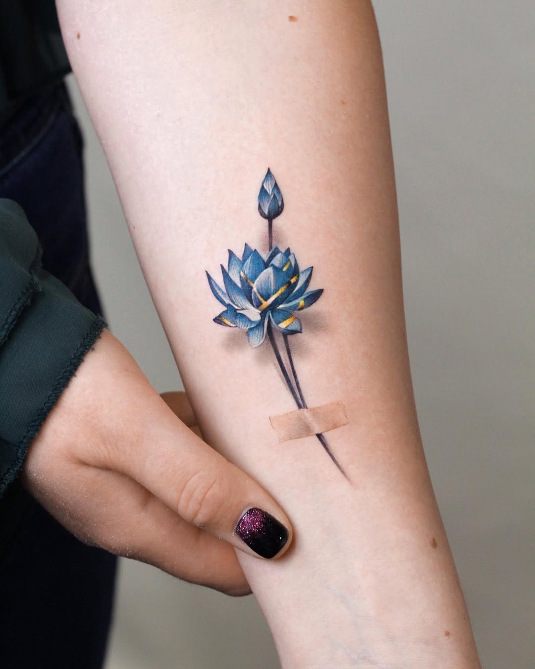 Serene lotus tattoo symbolizes strength and beauty.