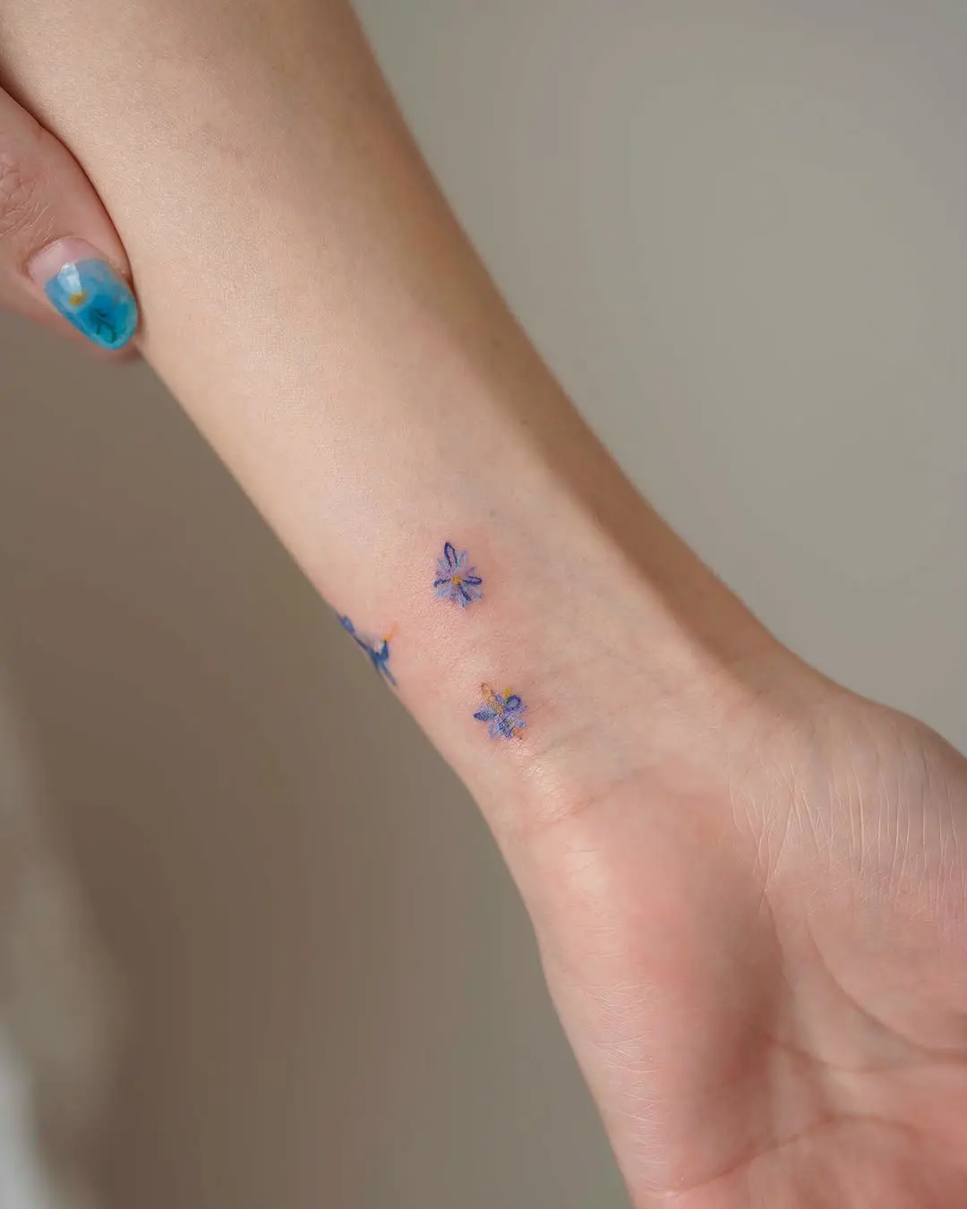 Delicate floral ink on a wrist for charm