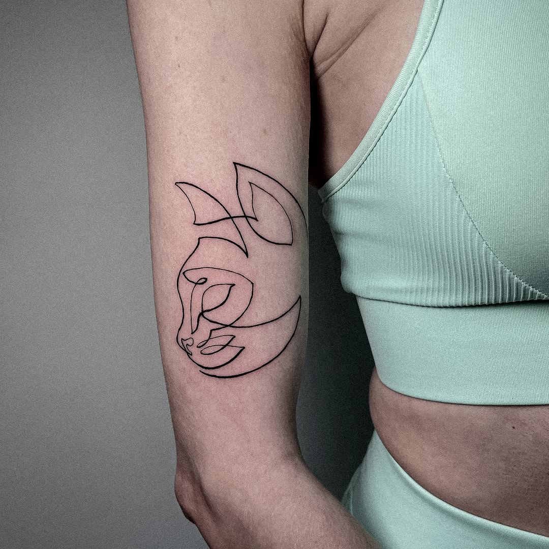 Elegant minimalist line art tattoo design