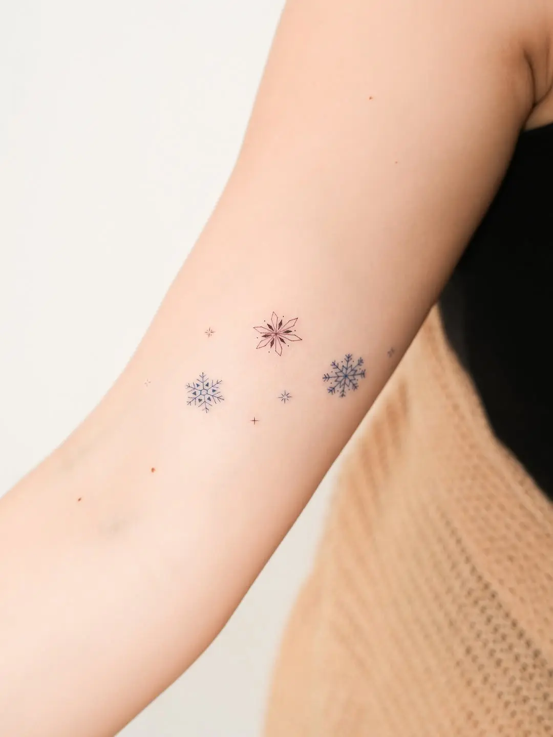 Elegant snowflake tattoos for a minimalist style