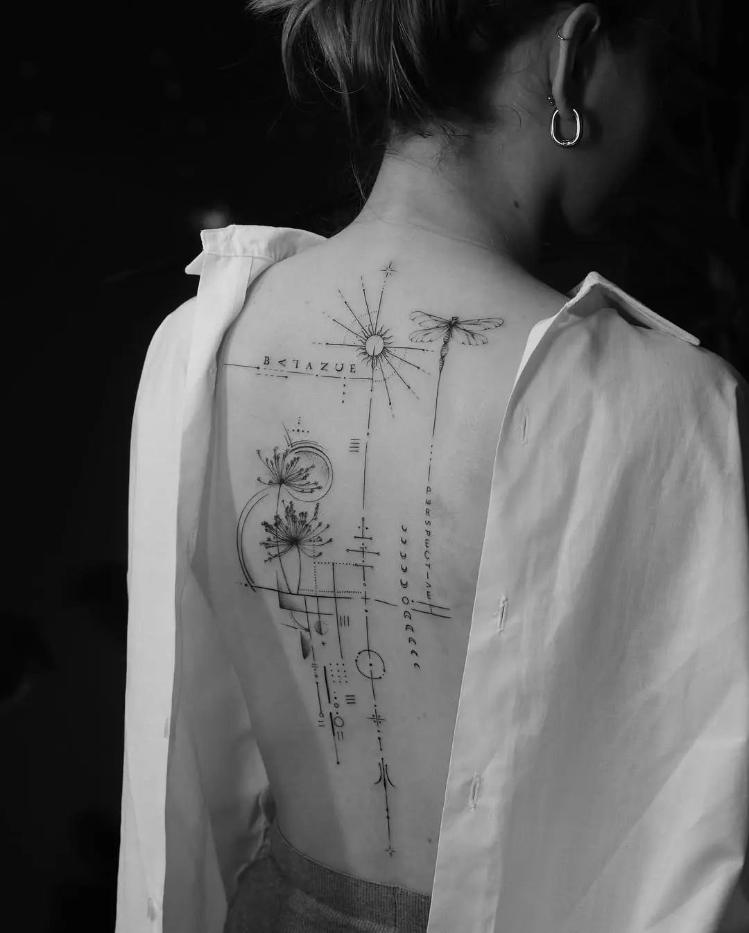 Elegant minimalist tattoo design on the back