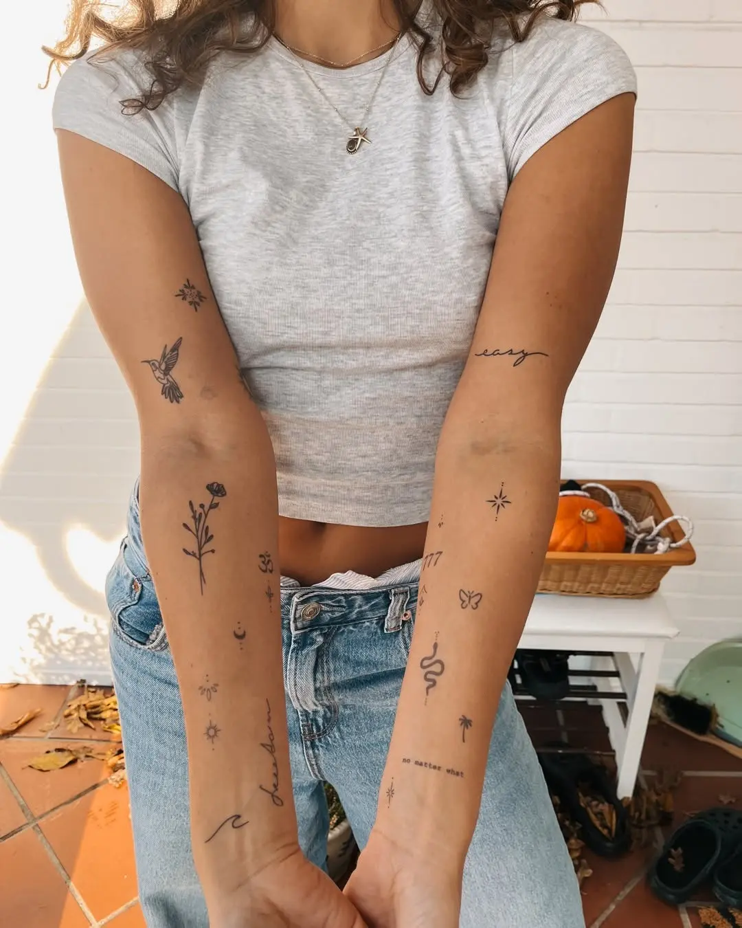 Charming assortment of minimalist tattoos on arms